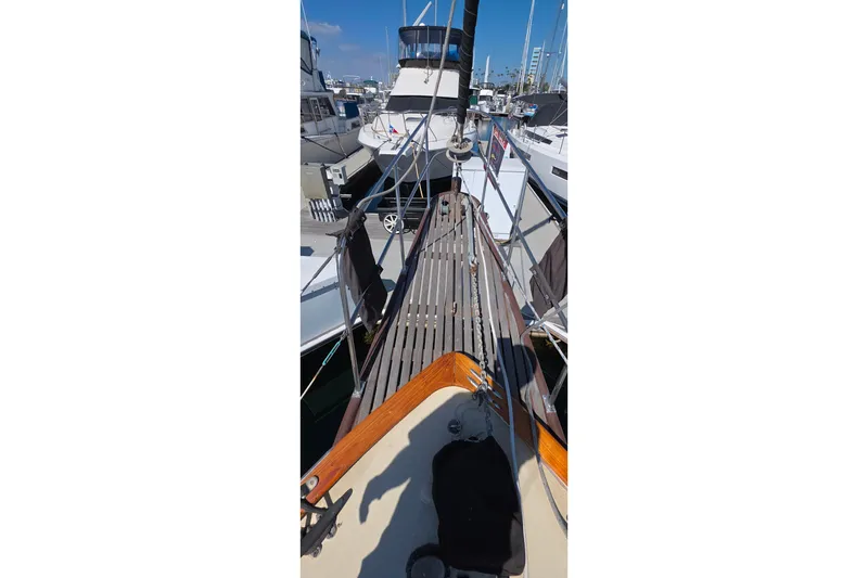 1978 Islander Freeport 41 sailboat docked at marina, showcasing deck and rigging.