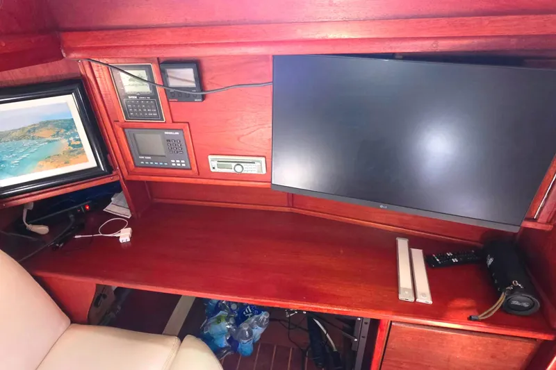 Interior of 1978 Islander Freeport 41 yacht with navigation equipment and monitor.