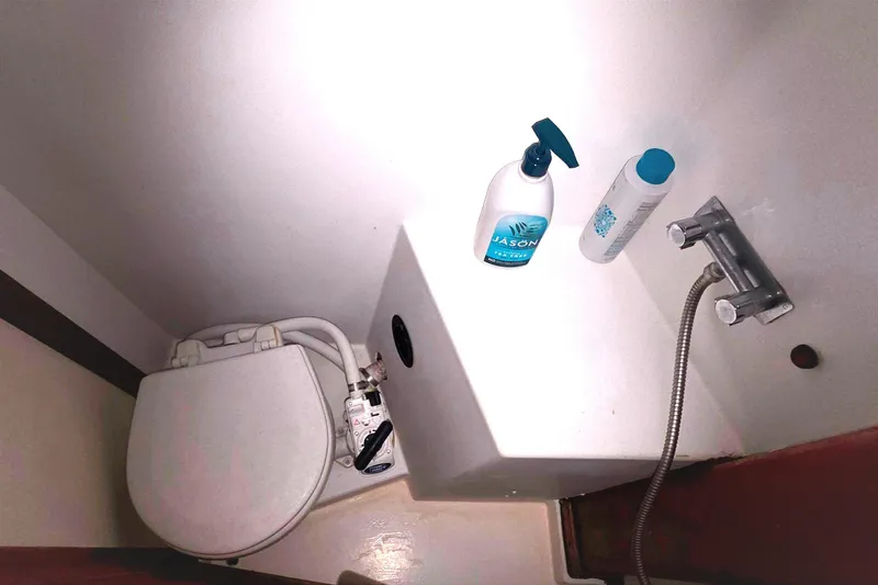 Interior of 1978 Islander Freeport 41 boat bathroom with toiletries and plumbing fixtures.