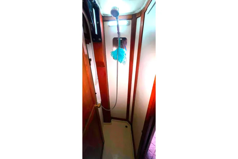 Narrow shower area inside a 1978 Islander Freeport 41 sailboat.