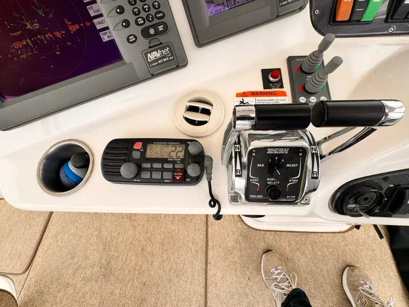 Control panel of a 2004 Riviera 47 Flybridge yacht with navigation equipment.