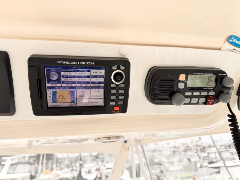 2004 Riviera 47 Flybridge navigation equipment with Standard Horizon display and radio.