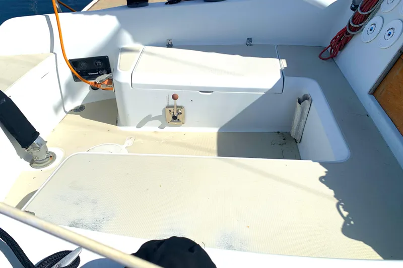 Cockpit of 1984 Ericson 30 Plus sailboat with seating and storage compartments.