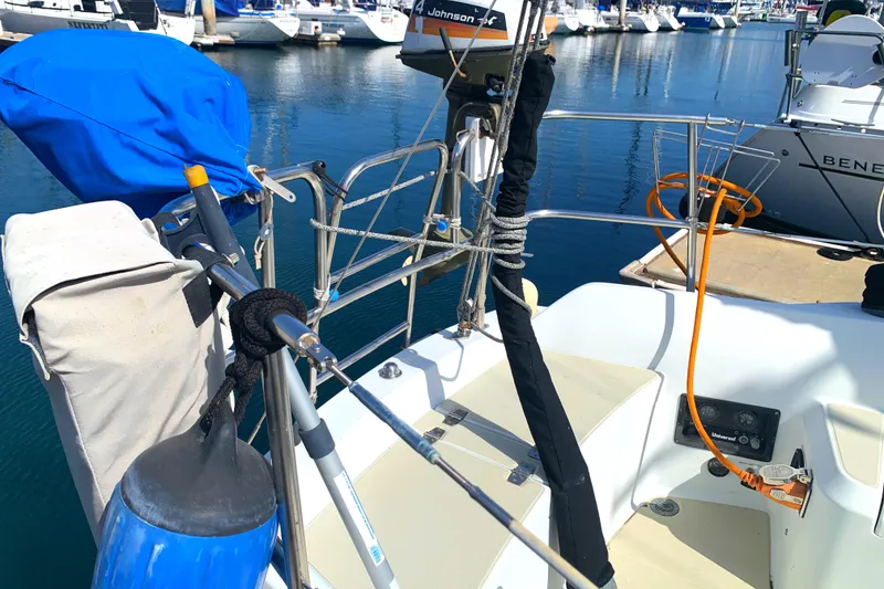 1984 Ericson 30 Plus sailboat stern with equipment and marina view.