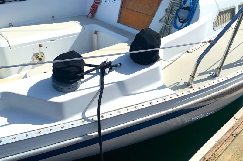 1984 Ericson 30 Plus sailboat deck with winches and ropes.