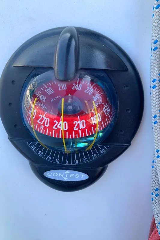 Compass on 1984 Ericson 30 Plus sailboat, showing heading of 270 degrees.