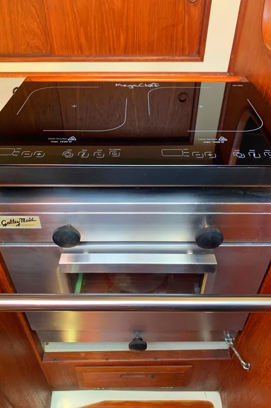Stainless steel marine stove and oven in 1984 Ericson 30 Plus yacht kitchen.