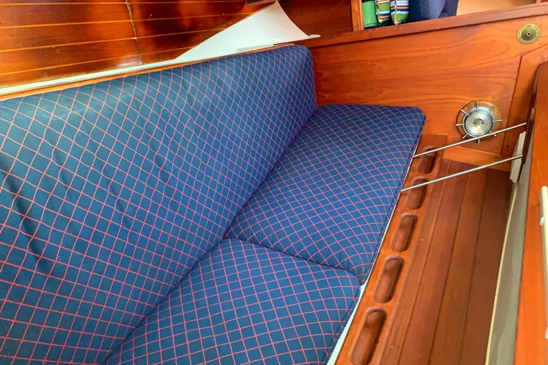Interior of 1984 Ericson 30 Plus sailboat with blue checkered seating.