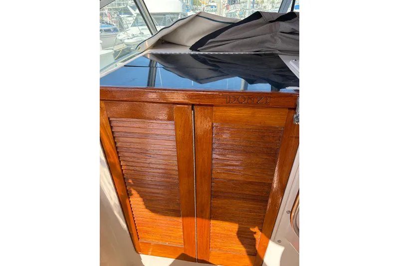 1991 Donzi 255 LXC boat interior with polished wooden cabinet.
