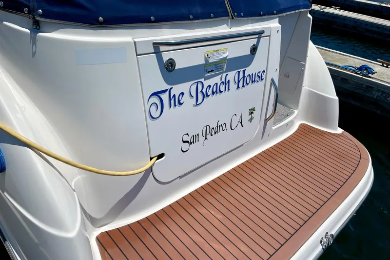 2008 Bayliner 265 boat named "The Beach House" docked in San Pedro, CA.