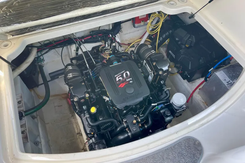 Engine compartment of a 2008 Bayliner 265 boat with MerCruiser 5.0 MPI engine.
