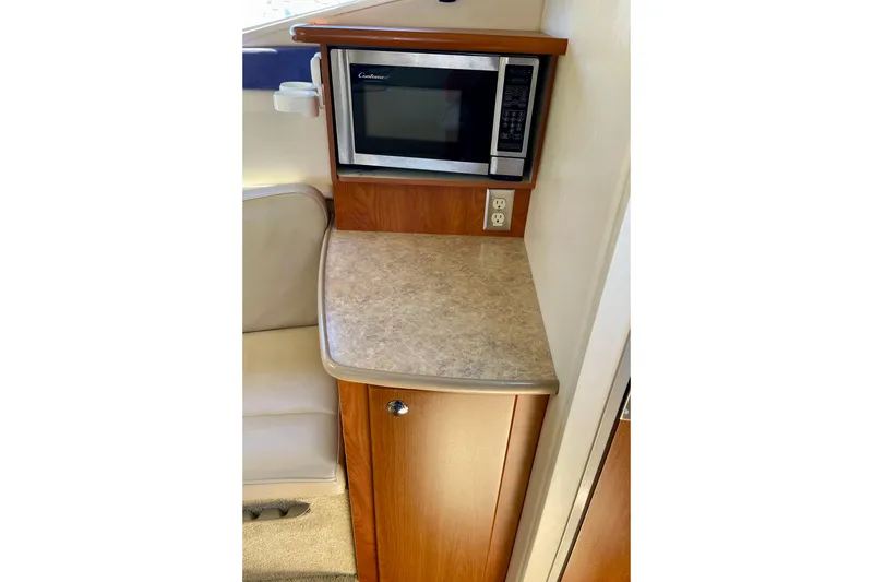 2008 Bayliner 265 interior with microwave and countertop in cabin area.