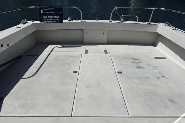 1972 Luhrs 32 Convertible boat deck with railing and storage compartments.