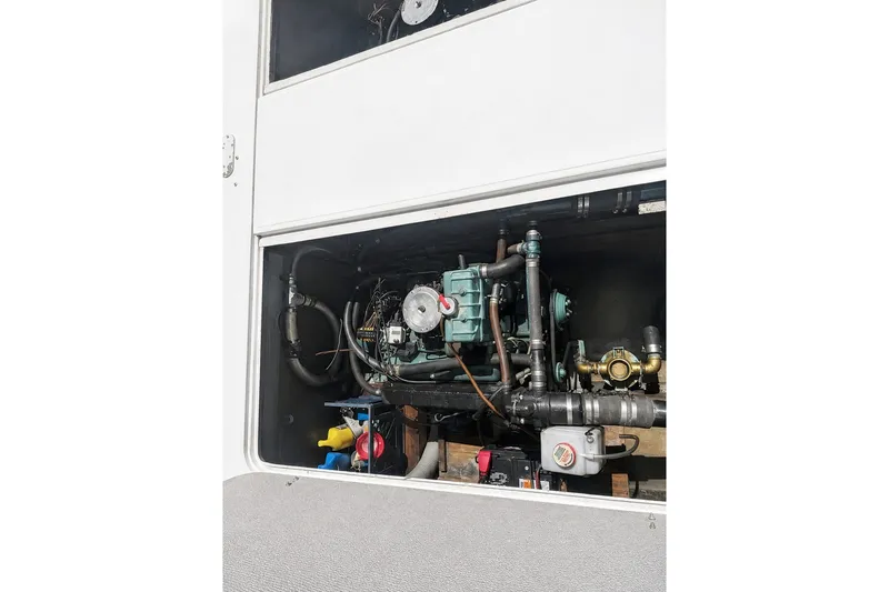 Engine compartment of a 1972 Luhrs 32 Convertible boat, showcasing mechanical components.