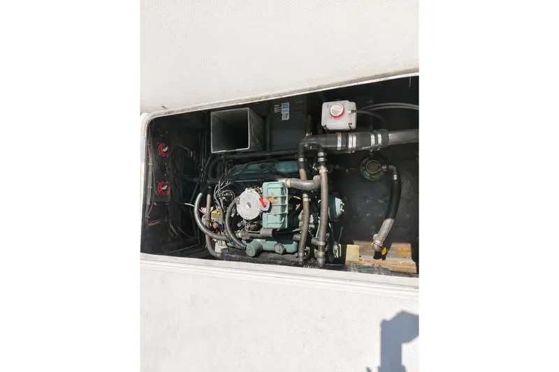 Engine compartment of a 1972 Luhrs 32 Convertible boat, showcasing mechanical components.