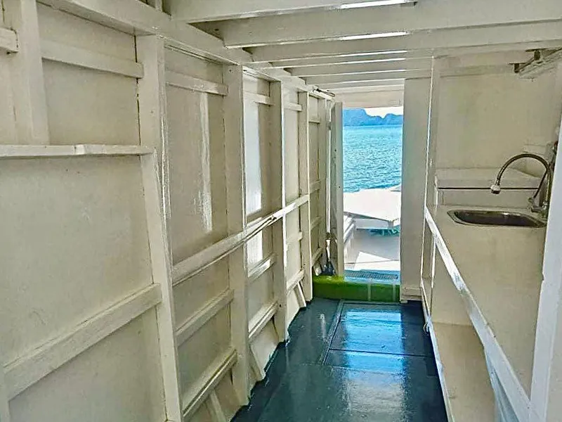 Interior of 2016 Phinisi Custom Pleasure Cruiser with ocean view through doorway.