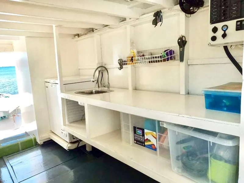 Interior of 2016 Phinisi Custom Pleasure Cruiser with sink, storage, and ocean view.