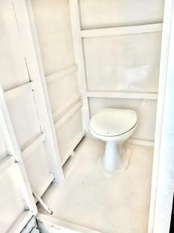 2016 Phinisi Custom Pleasure Cruiser bathroom with white interior.