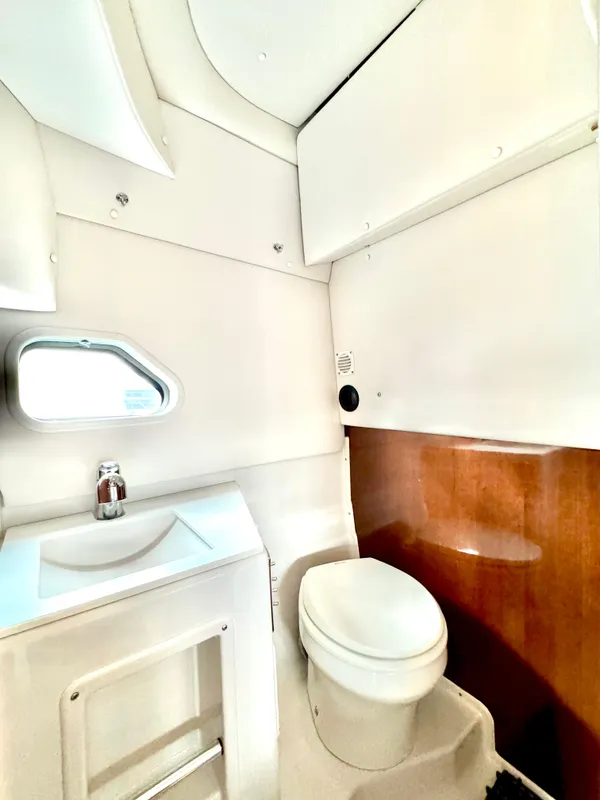 2016 Four Winns 255 Vista boat bathroom with sink and toilet.