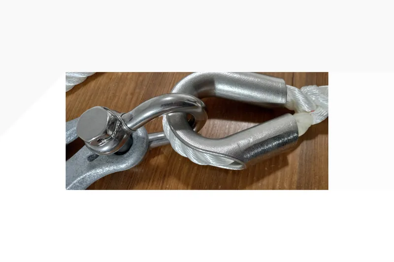 Close-up of a metal shackle and rope on a Pacific Seacraft Dana 24, 2002 model.