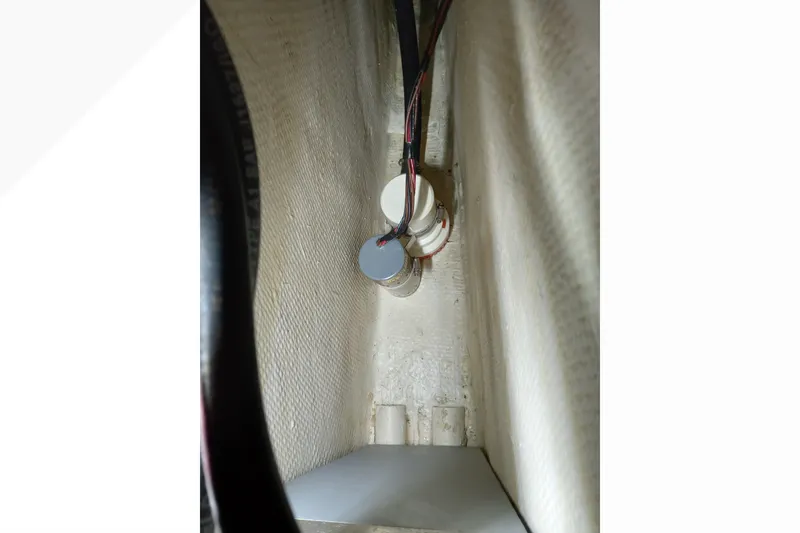 Interior view of a 2002 Pacific Seacraft Dana 24 sailboat, showing wiring and components.