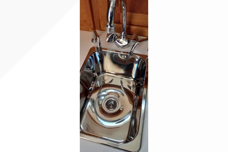 Stainless steel sink in 2002 Pacific Seacraft Dana 24 yacht galley.