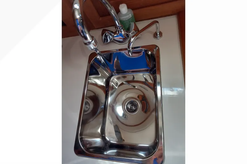 Stainless steel sink in 2002 Pacific Seacraft Dana 24 yacht galley.