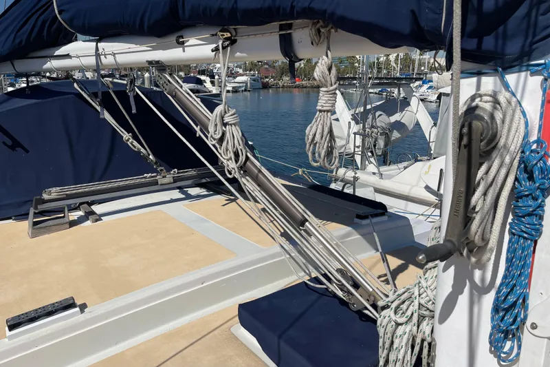 1978 Downeast 38 sailboat deck with rigging and ropes in a marina setting.