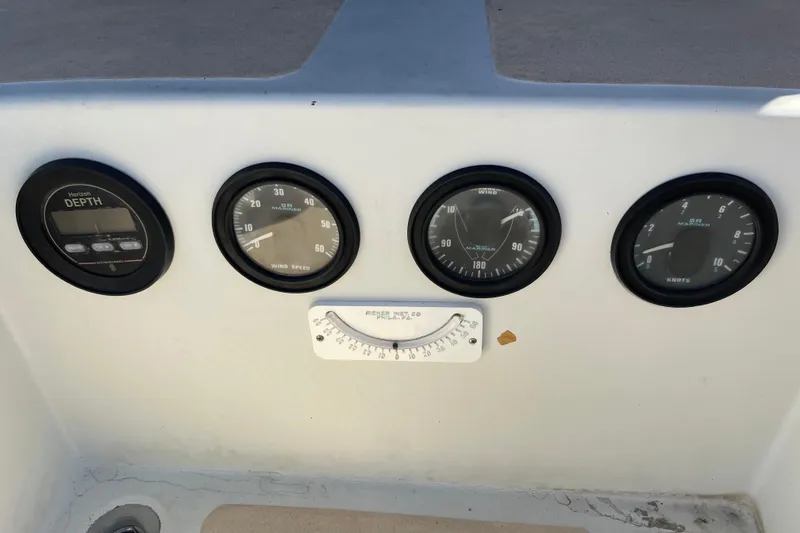 Control panel of a 1978 Downeast 38 boat with various gauges.
