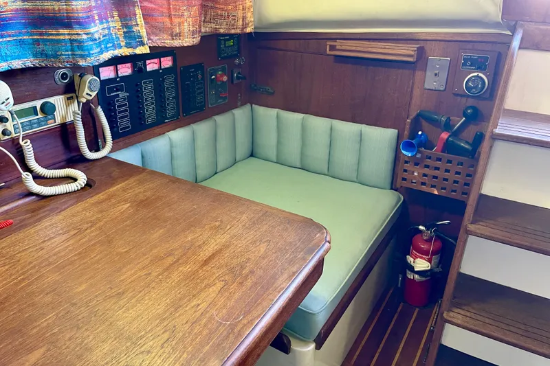 1978 Downeast 38 yacht interior with navigation equipment and seating area.