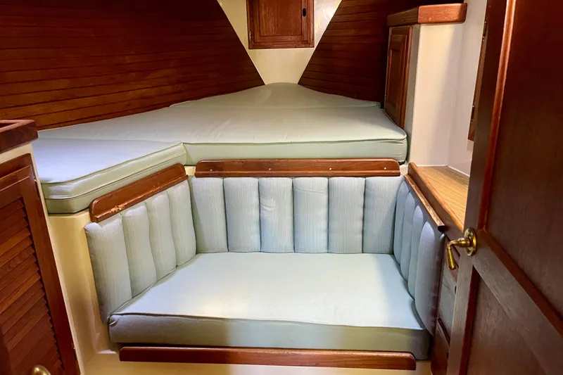 1978 Downeast 38 boat interior with cushioned seating and wooden accents.