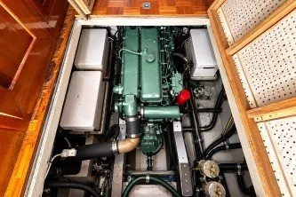 Engine compartment of a 1974 Grand Banks 32 Sedan, showcasing a well-maintained marine engine.