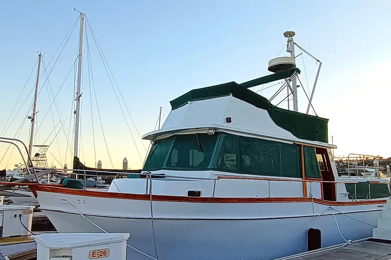 1978 Californian LRC yacht docked at marina during sunset.