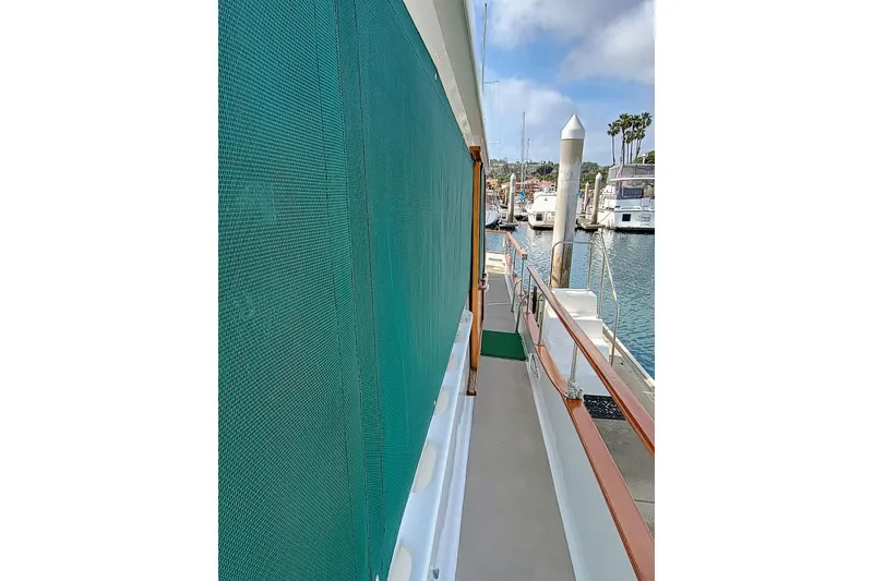 Side view of 1978 Californian LRC yacht docked at marina.