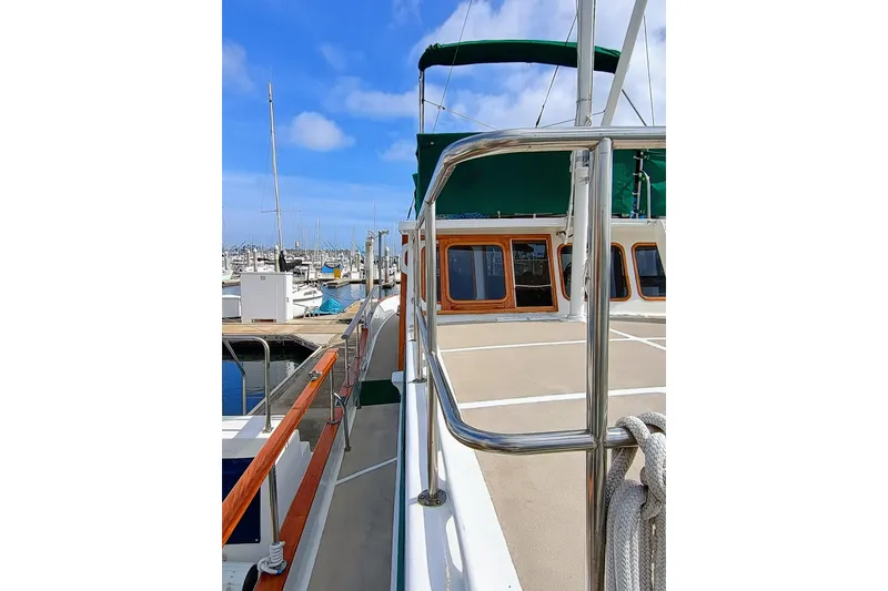1978 Californian LRC yacht docked at marina, featuring polished railings and wooden accents.