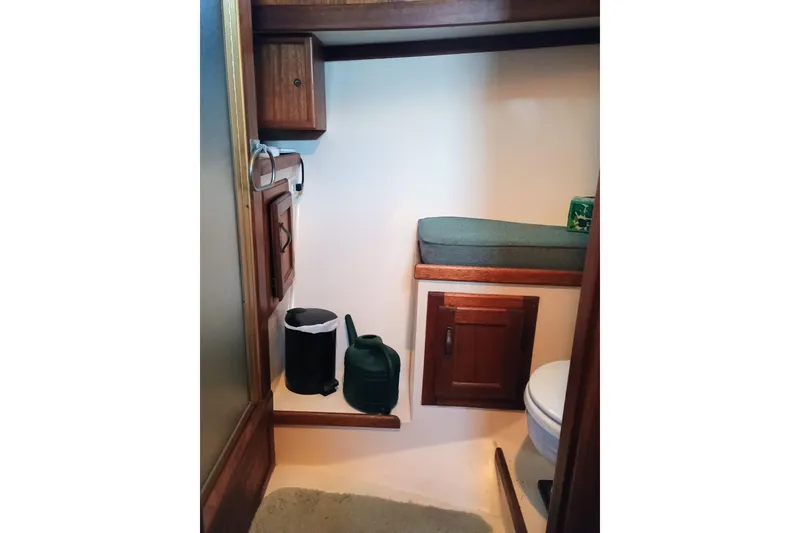 1978 Californian LRC boat interior with wooden cabinets and cushioned seating.