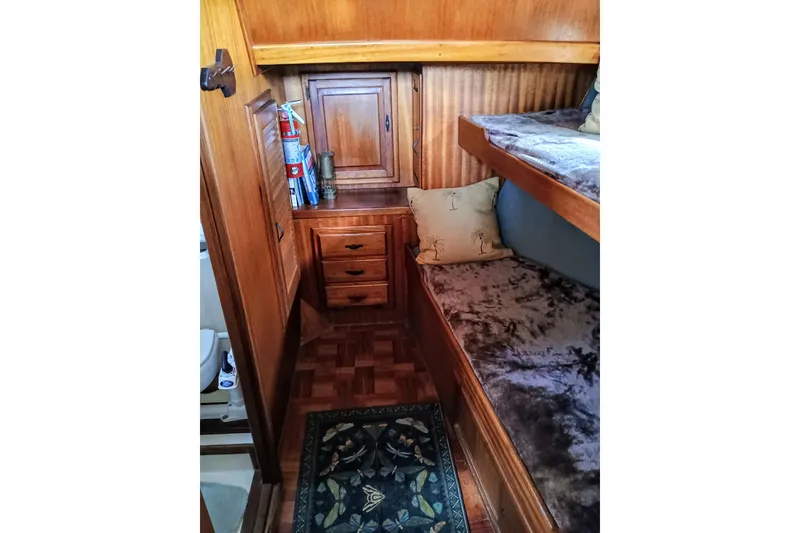 1978 Californian LRC cabin interior with wooden bunk beds and storage.