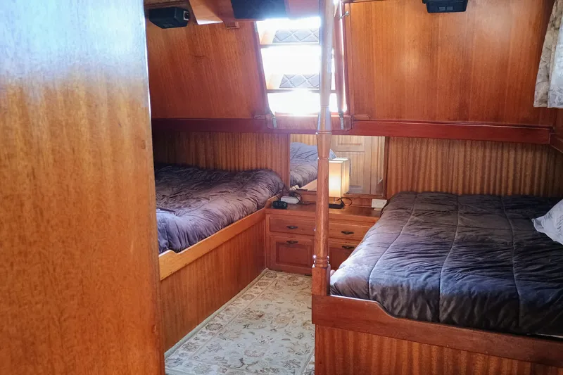 1978 Californian LRC cabin interior with twin beds and wooden furnishings.