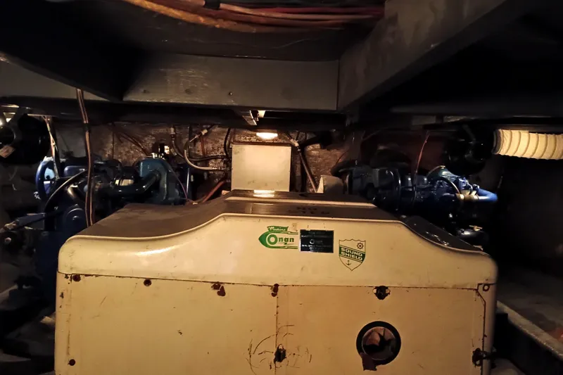 Engine room of a 1978 Californian LRC boat with Onan generator.