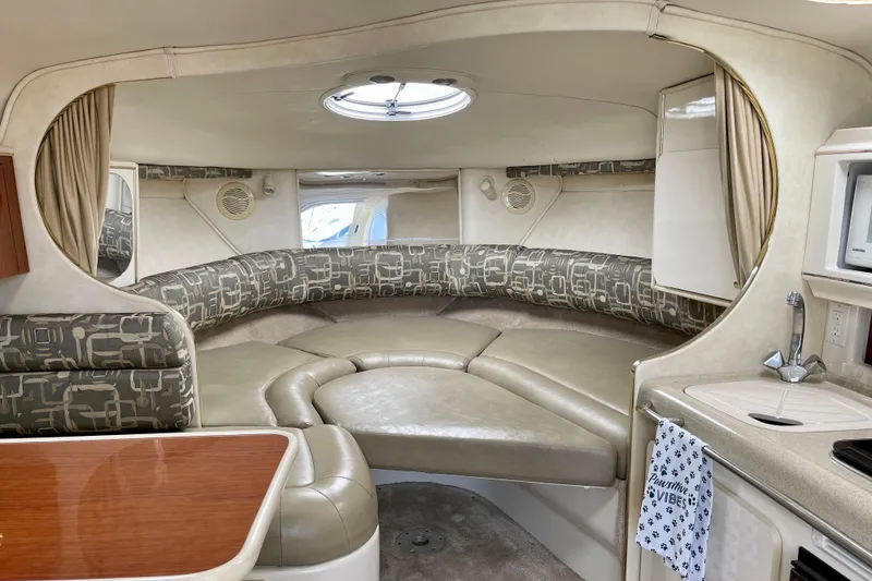 Interior of a 2000 Monterey 302 Cruiser with cozy seating and kitchenette.