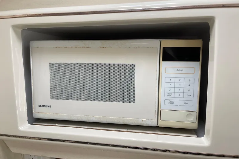 Samsung microwave in a 2000 Monterey 302 Cruiser kitchen setup.