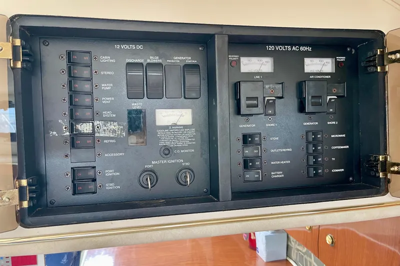 Electrical control panel of a 2000 Monterey 302 Cruiser boat, featuring switches and gauges.