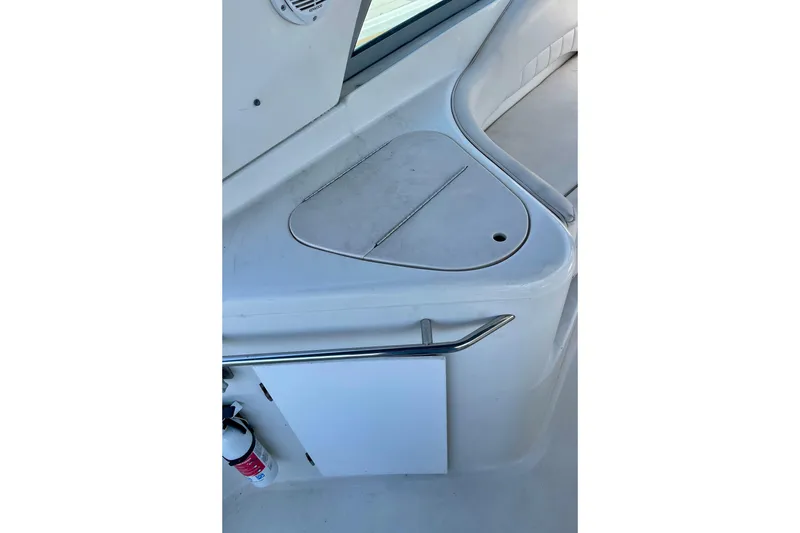 Interior view of a 2000 Monterey 302 Cruiser boat, featuring a sleek white design.
