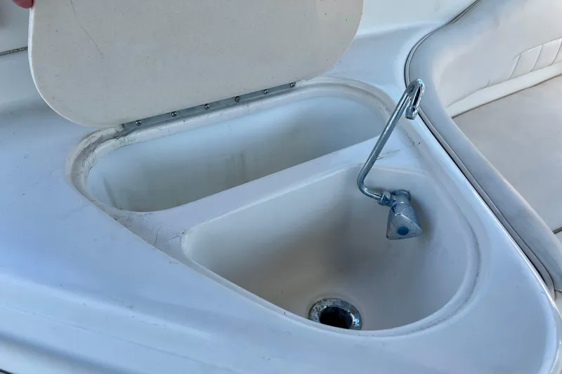 Open sink compartment on a 2000 Monterey 302 Cruiser boat.