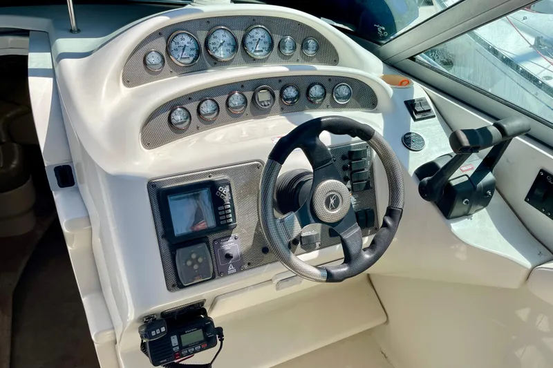 Cockpit of a 2000 Monterey 302 Cruiser with steering wheel and instrument panel.