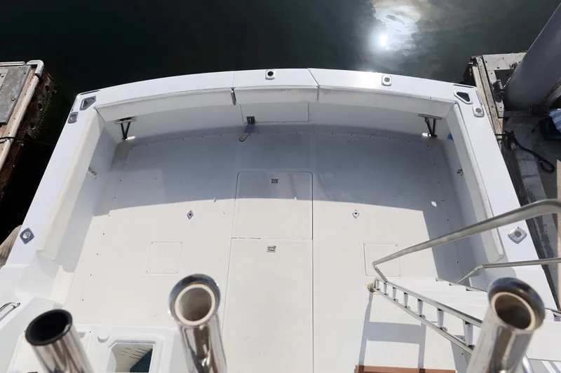 1980 Pacifica 41 Sportfisher boat deck, spacious and clean, docked at marina.