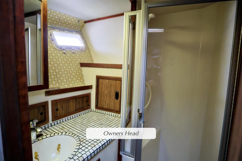 1980 Pacifica 41 Sportfisher owner's head with tiled countertop and shower.