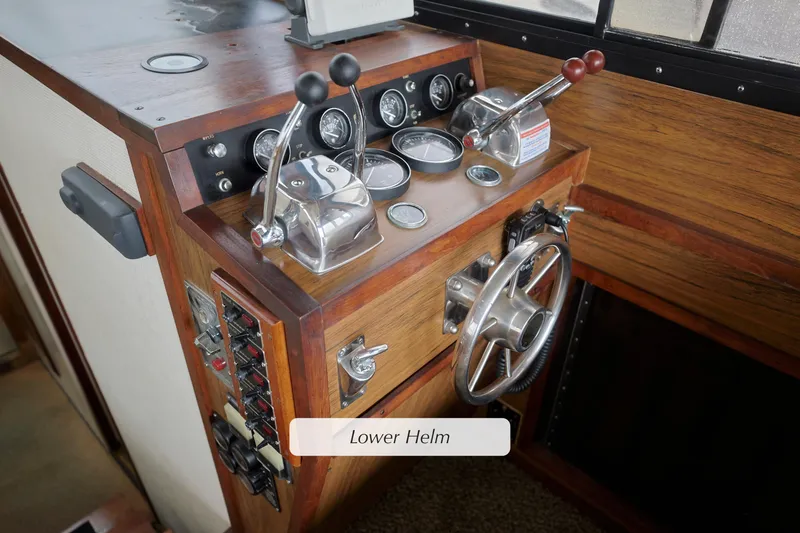 Lower helm of 1980 Pacifica 41 Sportfisher with wooden finish and control panel.