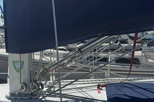 Sailboat rigging on a 2000 Catalina 320, docked in a marina.