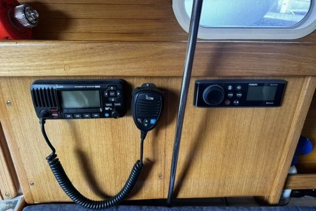 Control panel of a 2000 Catalina 320 sailboat with radio and navigation equipment.